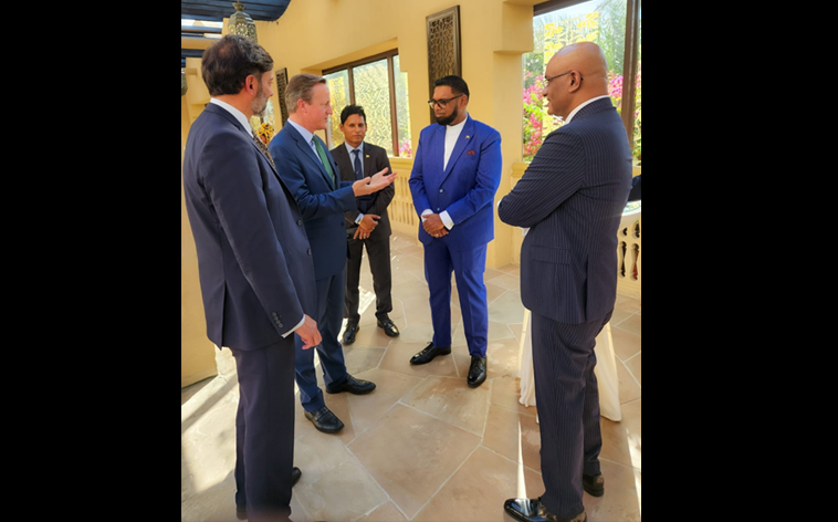 Foreign Minister of United Kingdom Mr. David Cameron of the United Kingdom talking to President Dr. Irfaan Ali and Vice President Dr. Bharrat Jagdeo.