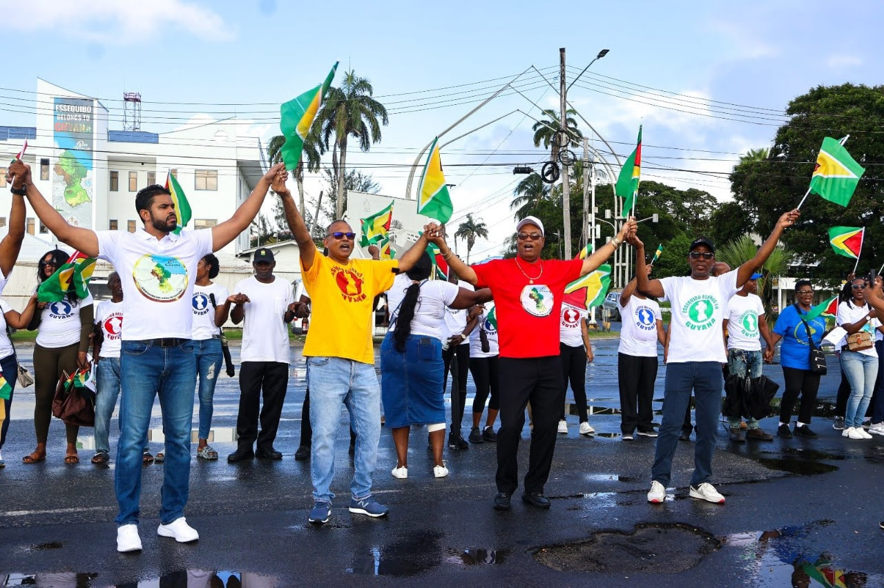 Gov’t ministers joining guyanese citizen in display of national unity