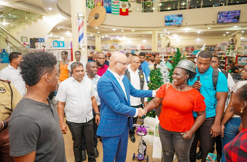 Dr Bharrat Jagdeo connecting with a happy lady