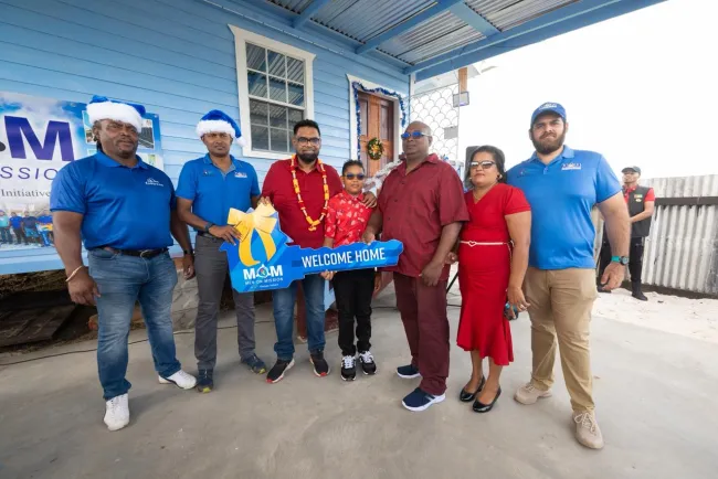 President Ali gifts Enterprise family new home for Christmas President Dr Mohamed Irfaan Ali, together with 46-year-old James Hercules and his family, at the simple handing over ceremony on Christmas Day