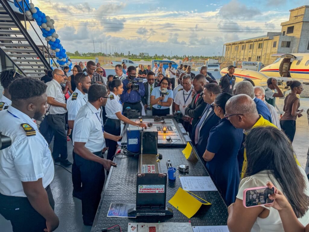 Minister of Utilities and Aviation Deodat Indar with other officials and the Director General of the GCAA Mr Field