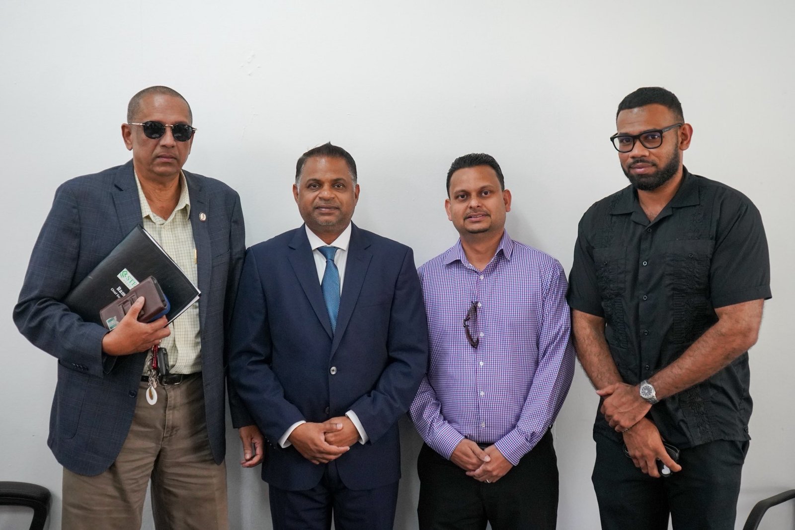 Minister of Public Utilities and Aviation, Mr Deodat Indar with the representative of Water Industry