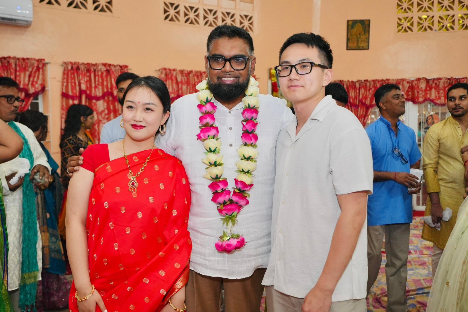 President Dr Irfaan Ali and devotees at Alexander Temple