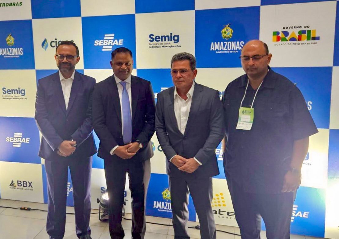 Minister of Public Utilities and Aviation, Deodat Indar with Winston A. M. Brassington and others