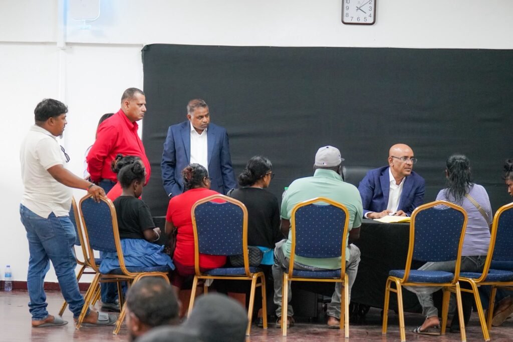 Vice president Dr. Bharrat Jagdeo, Minister of Public Works and Aviation Deodat Indar interacting with Region Six Peoples