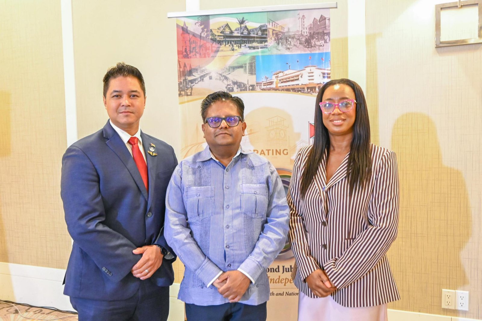 Finance Minister Ashni Singh with PSC Chairman Gerald Gouveia Jr and Vice-Chairwoman Kathy Smith