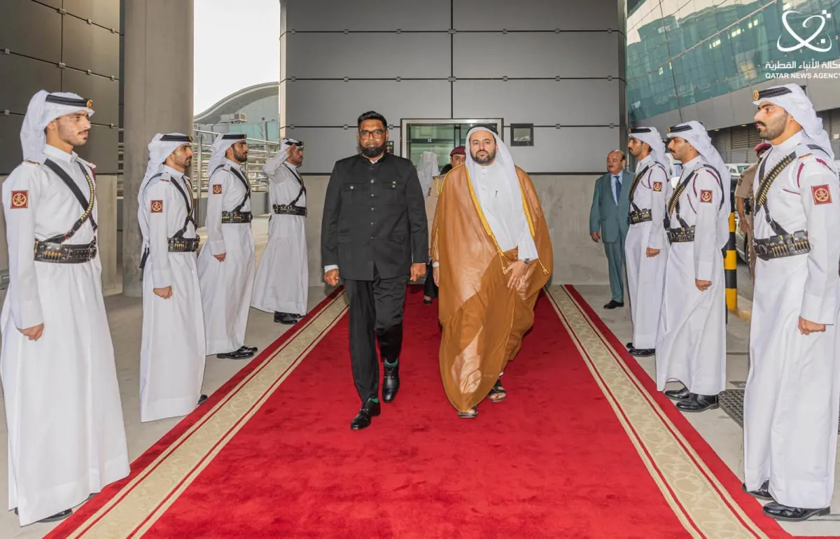 President Dr Mohamed Irfaan Ali receives a Guard of Honour upon arrival in Doha