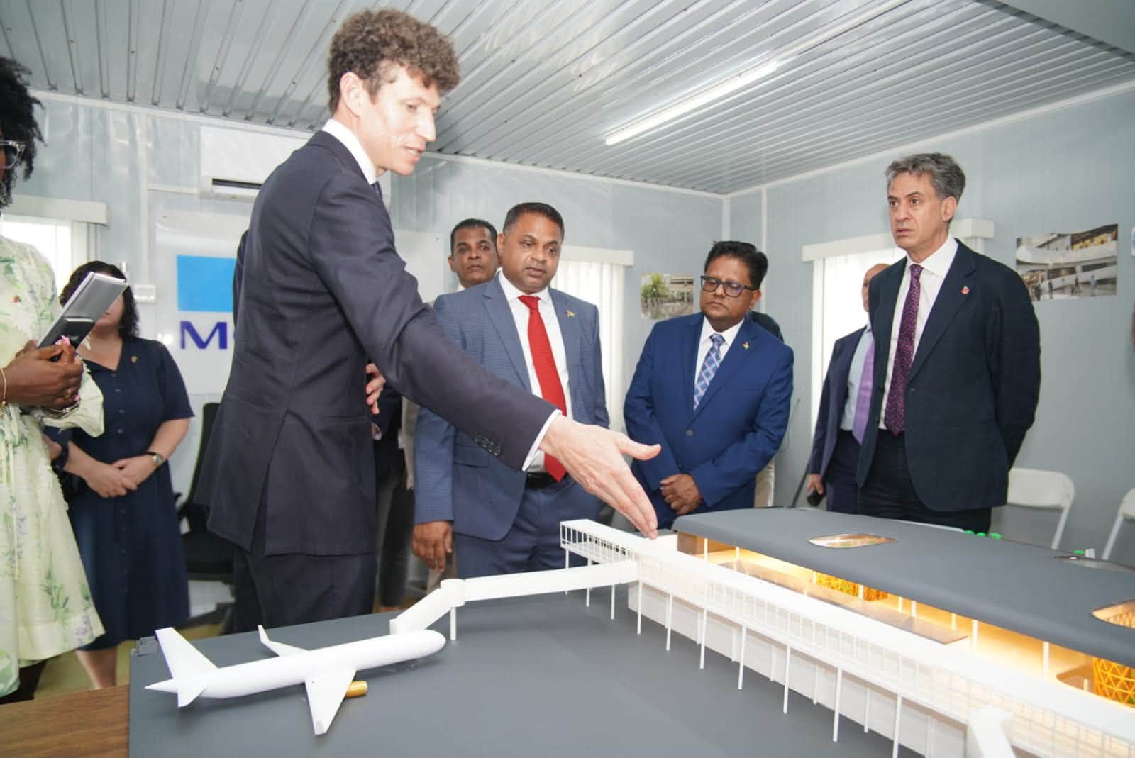 Minister of Public Utilities and Aviation Deodat Indar, Ashni Singh, and Ed Miliband
