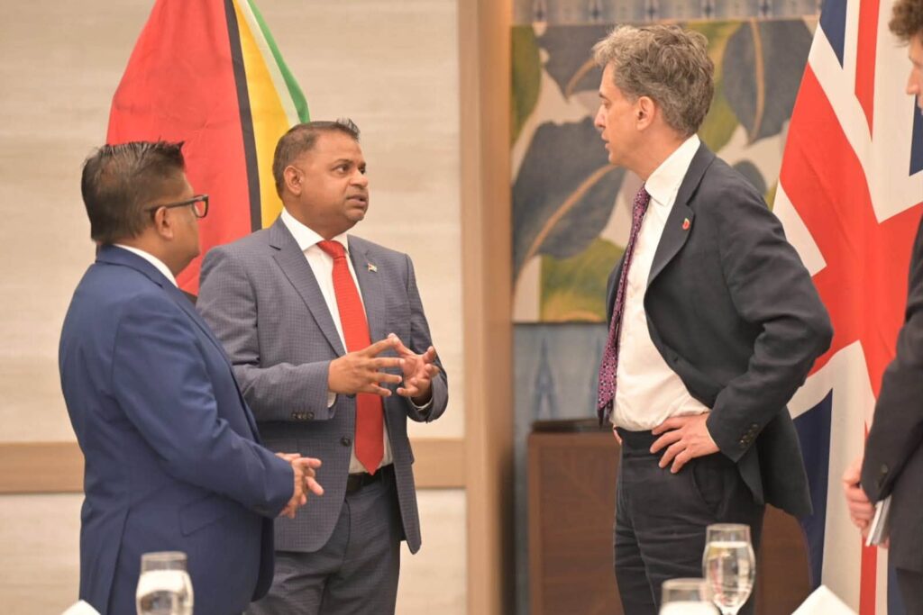 Minister of Public Utilities and Aviation Deodat Indar, Ashni Singh, and Ed Miliband